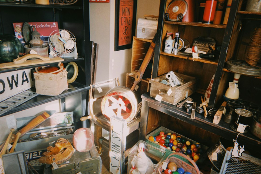 A collection of vintage items on shelves and the floor