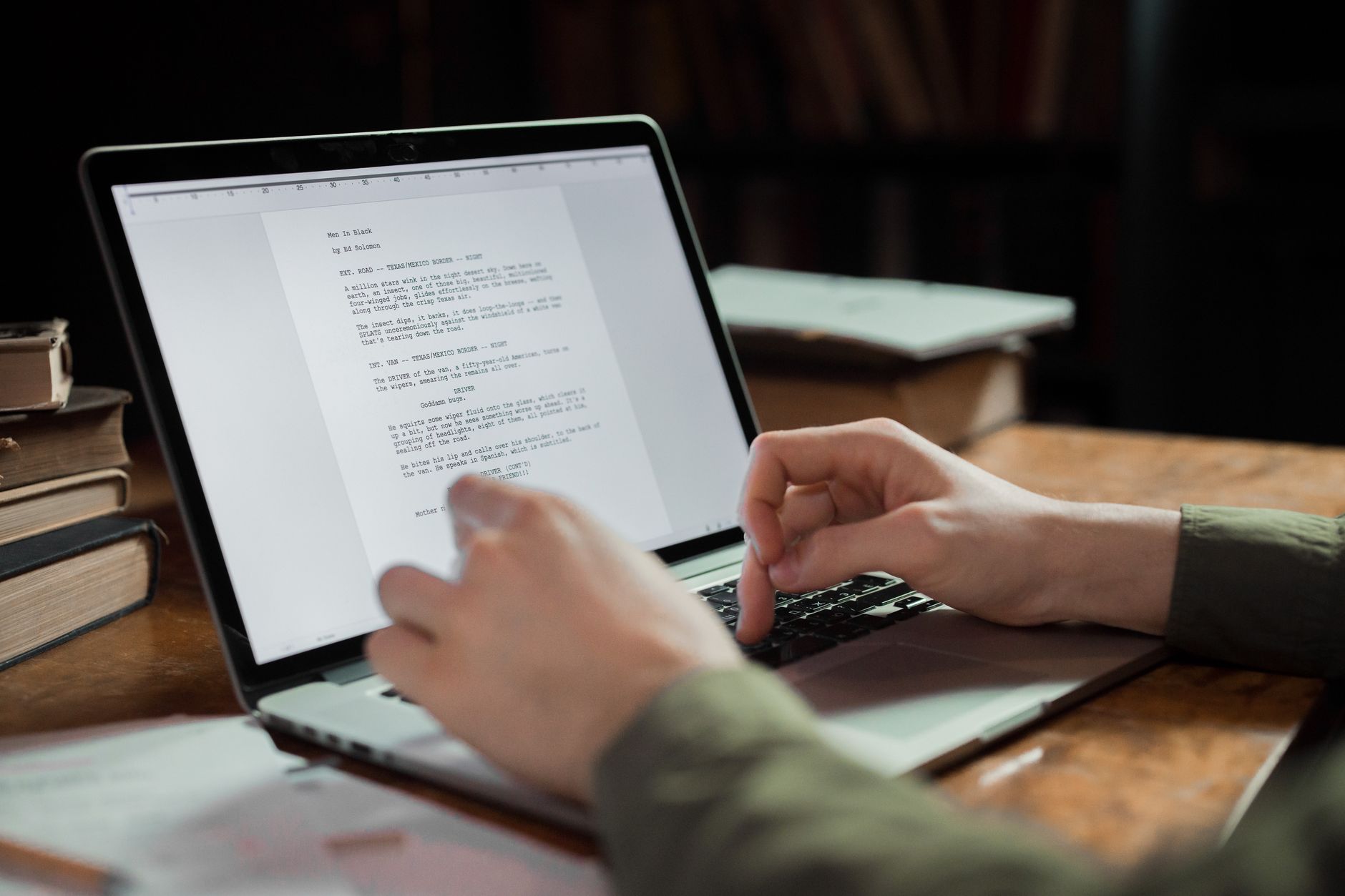 A person editing text on a laptop
