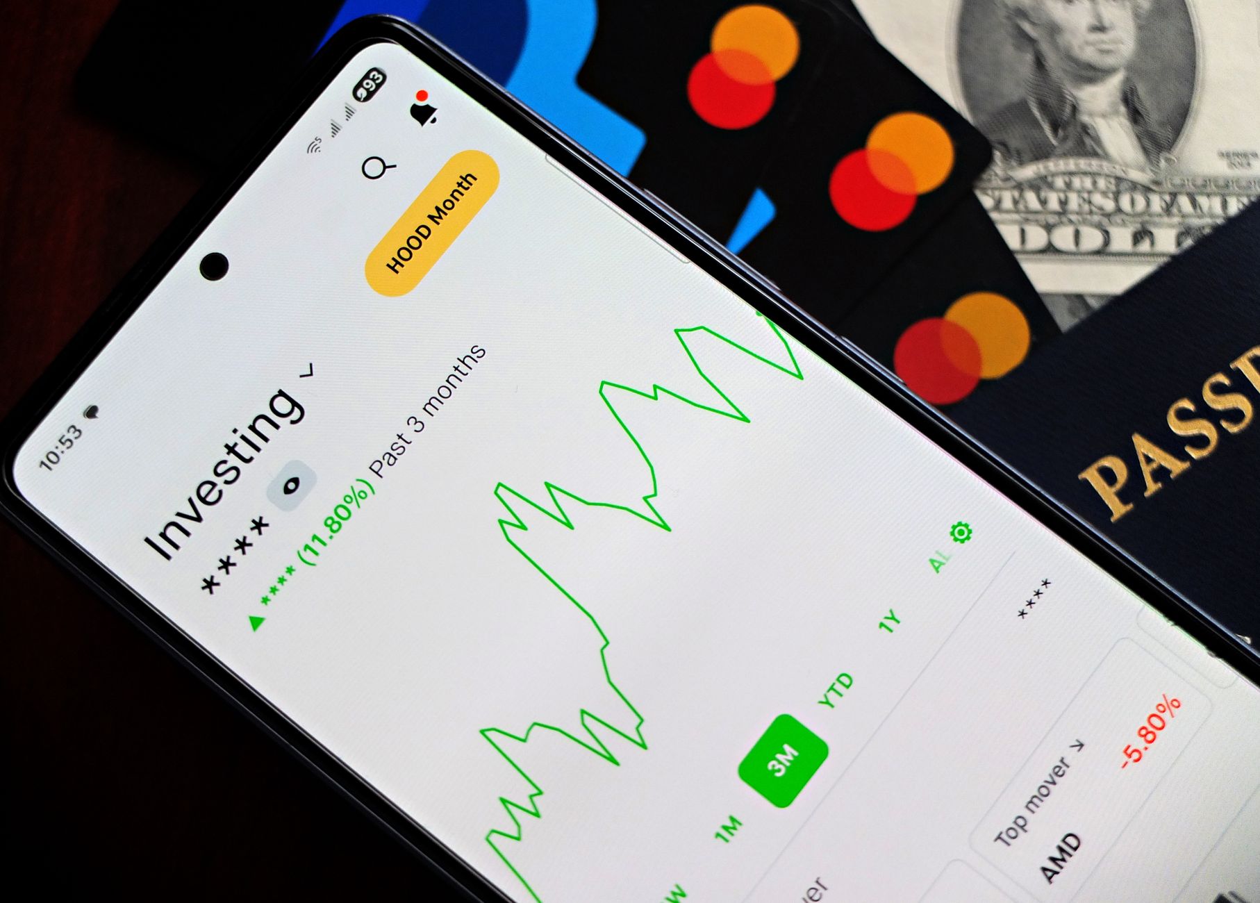 A smartphone displaying an investment app with a growth chart