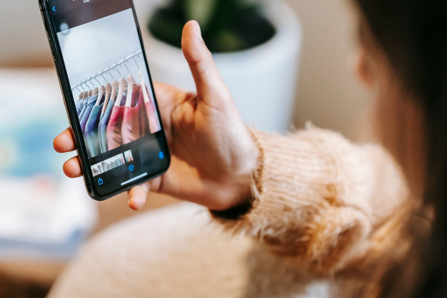 A person using a smartphone while shopping