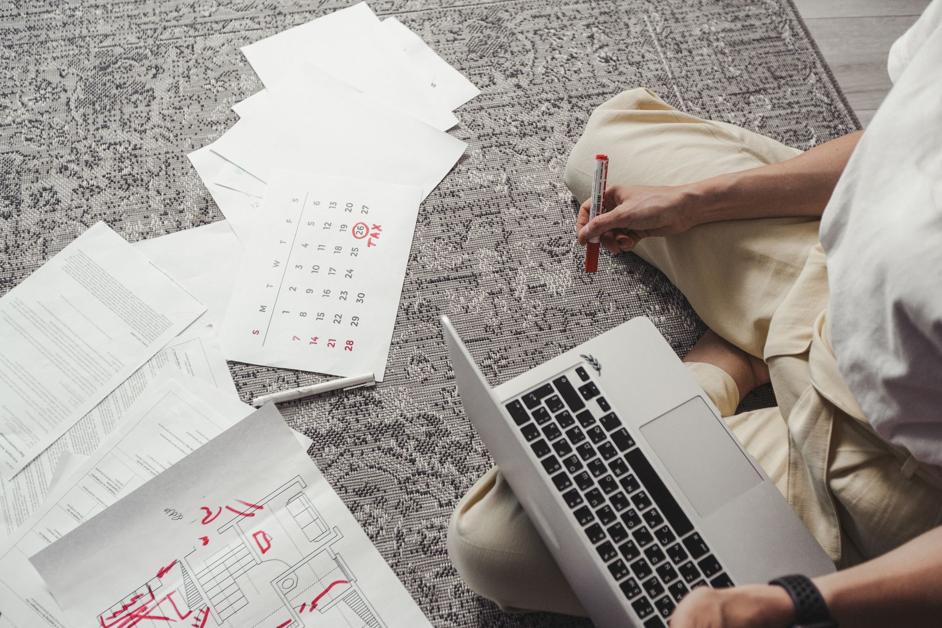A person reviewing a calendar on a laptop