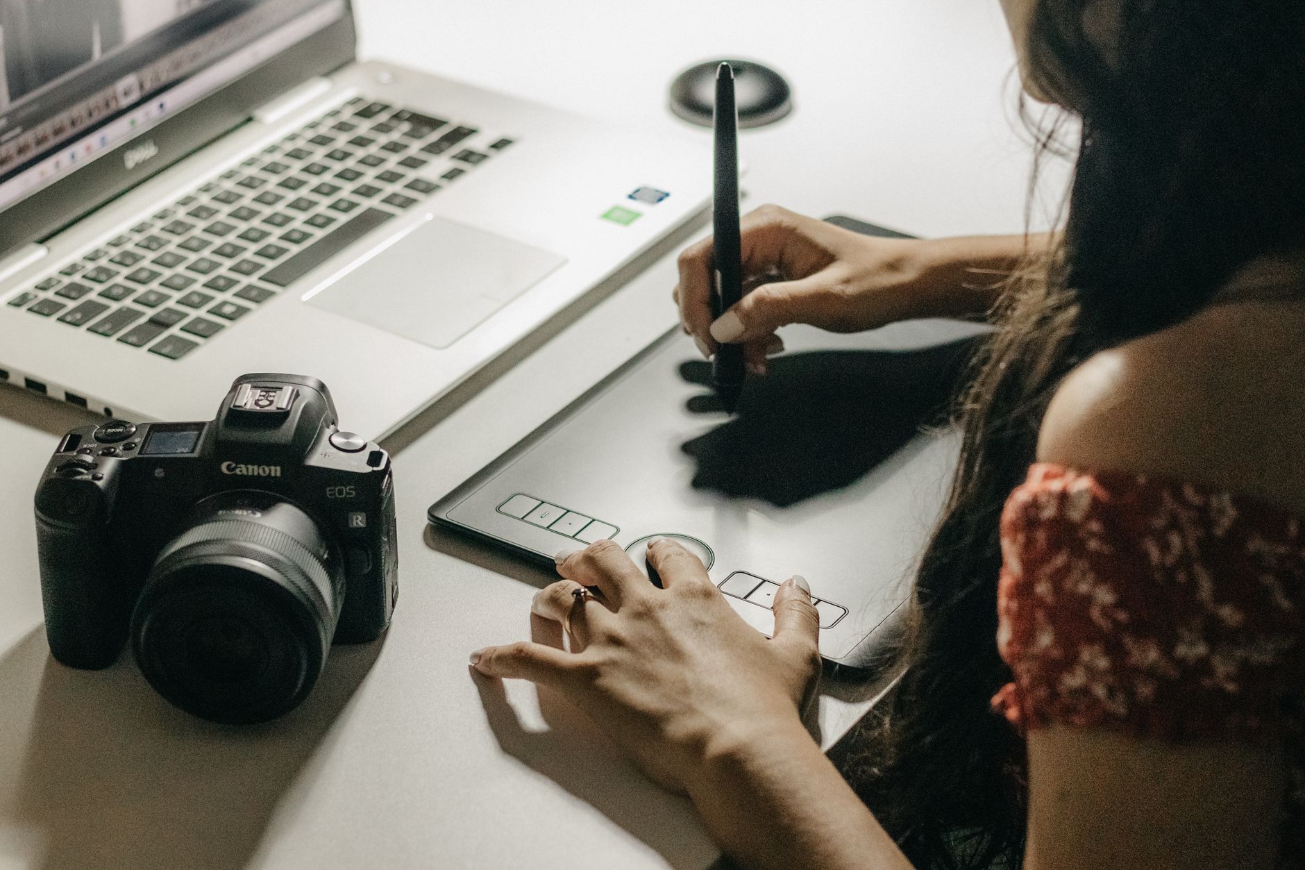 A graphic designer at work on a tablet