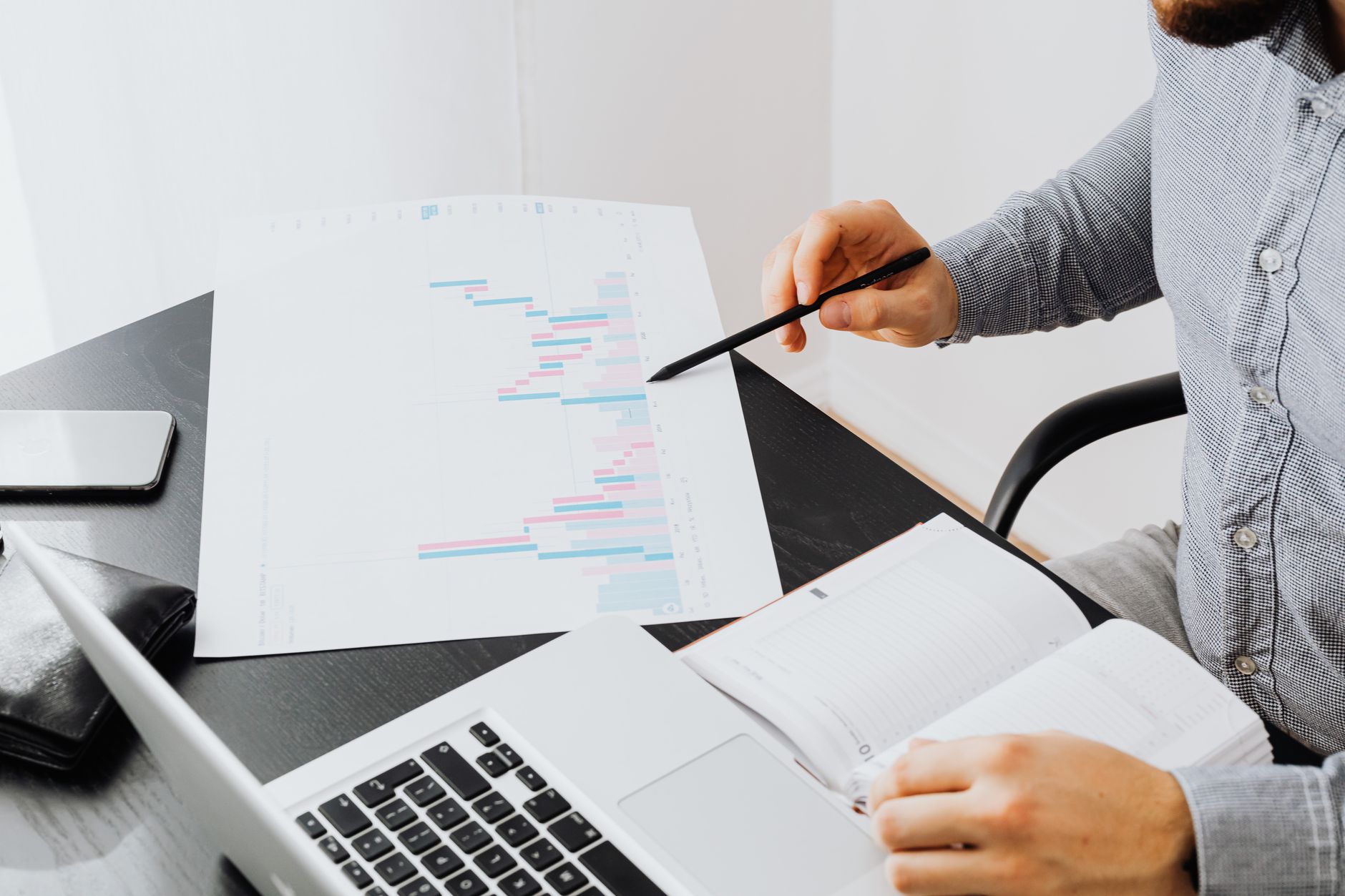 A marketer reviewing charts on a laptop