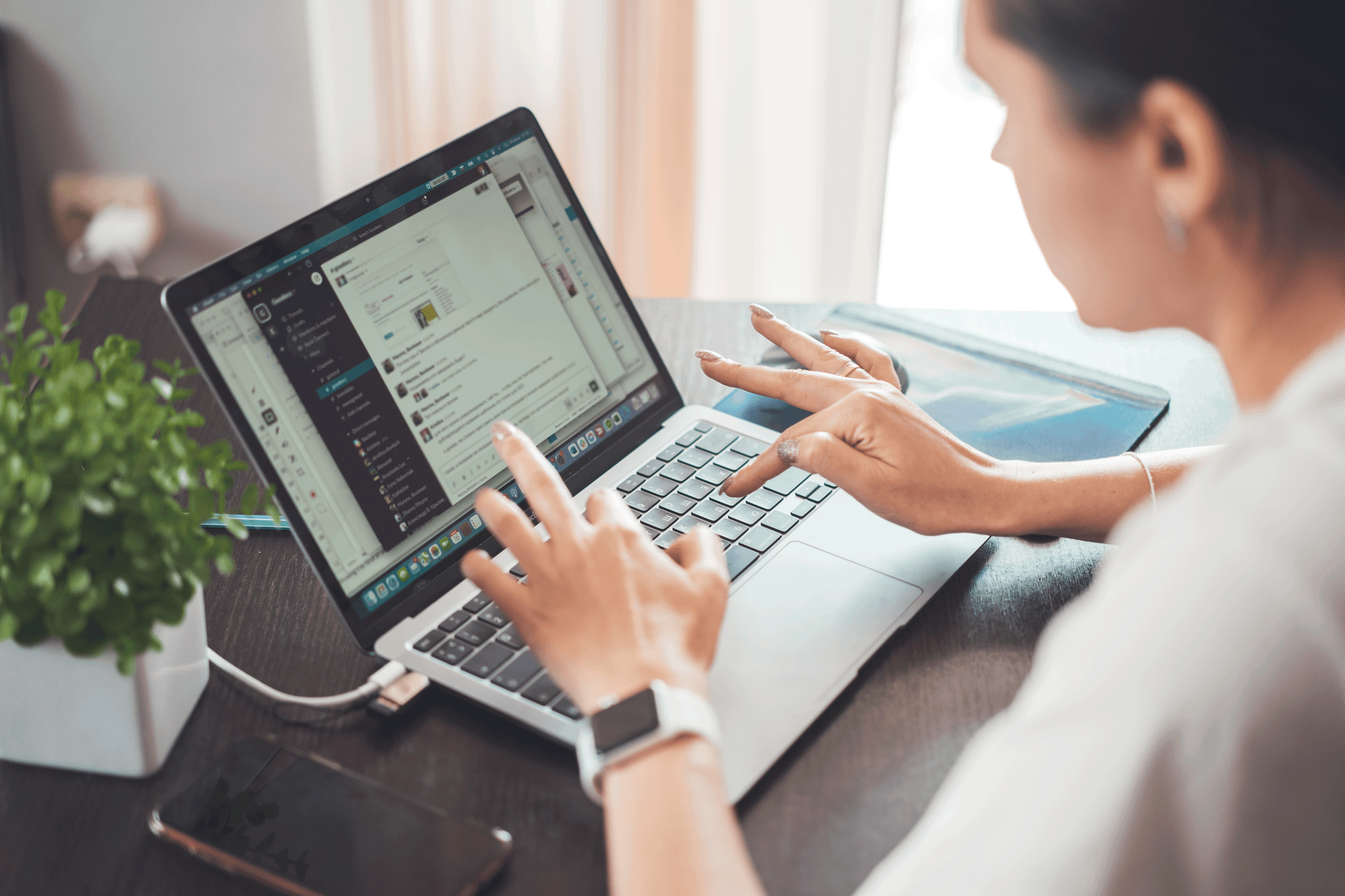 A woman preparing an application on a laptop