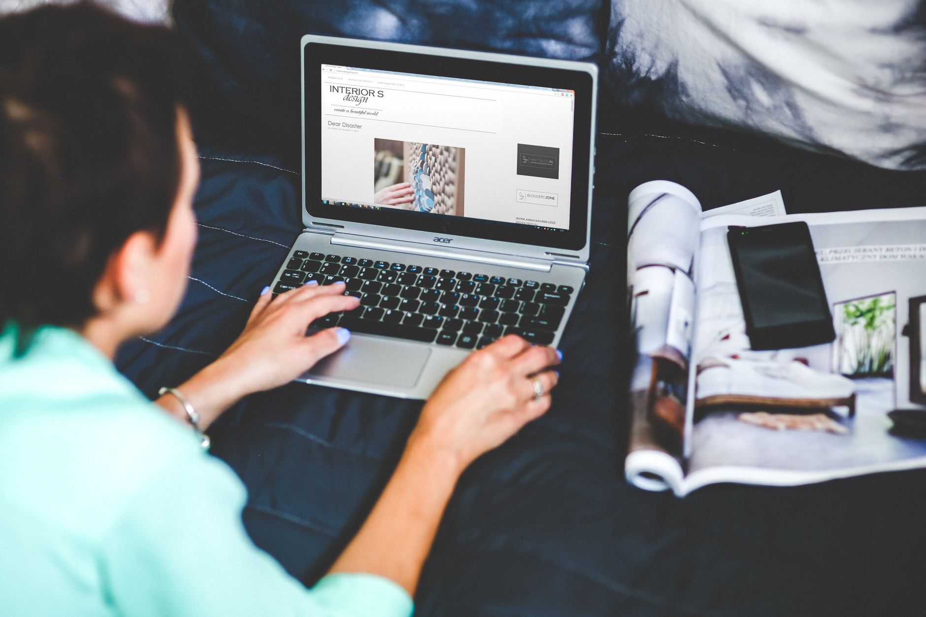 A woman reading a newsletter on her phone