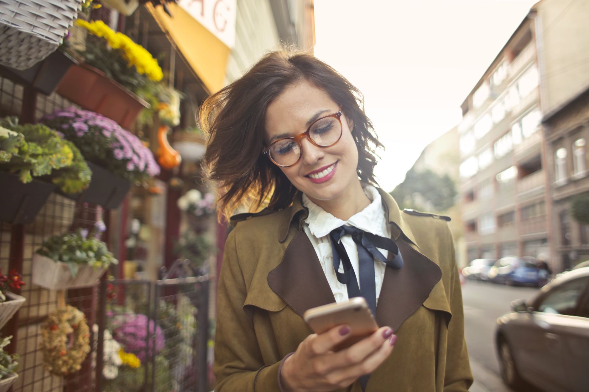 A woman shopping with her phone in hand