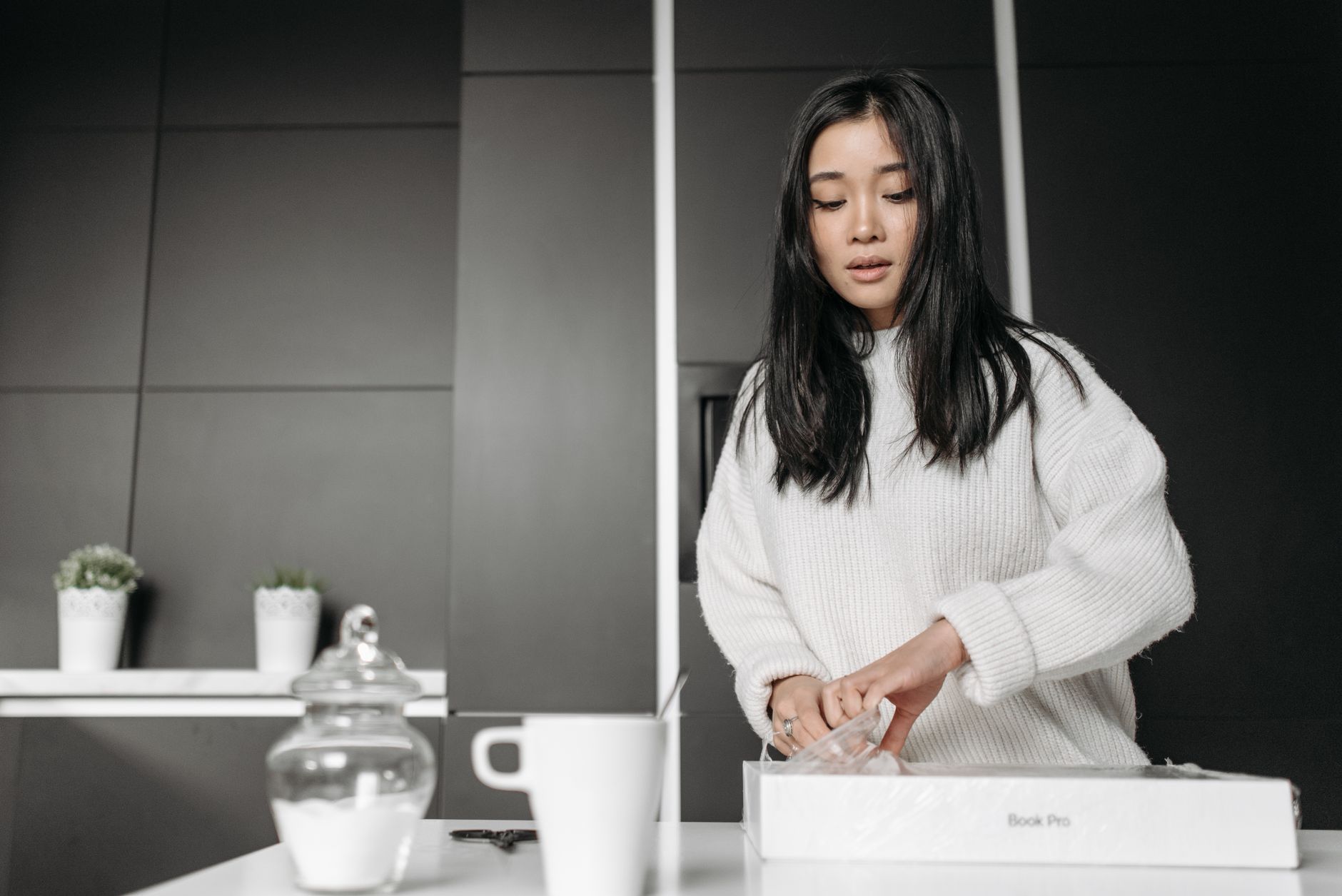 A woman unboxing a product at home