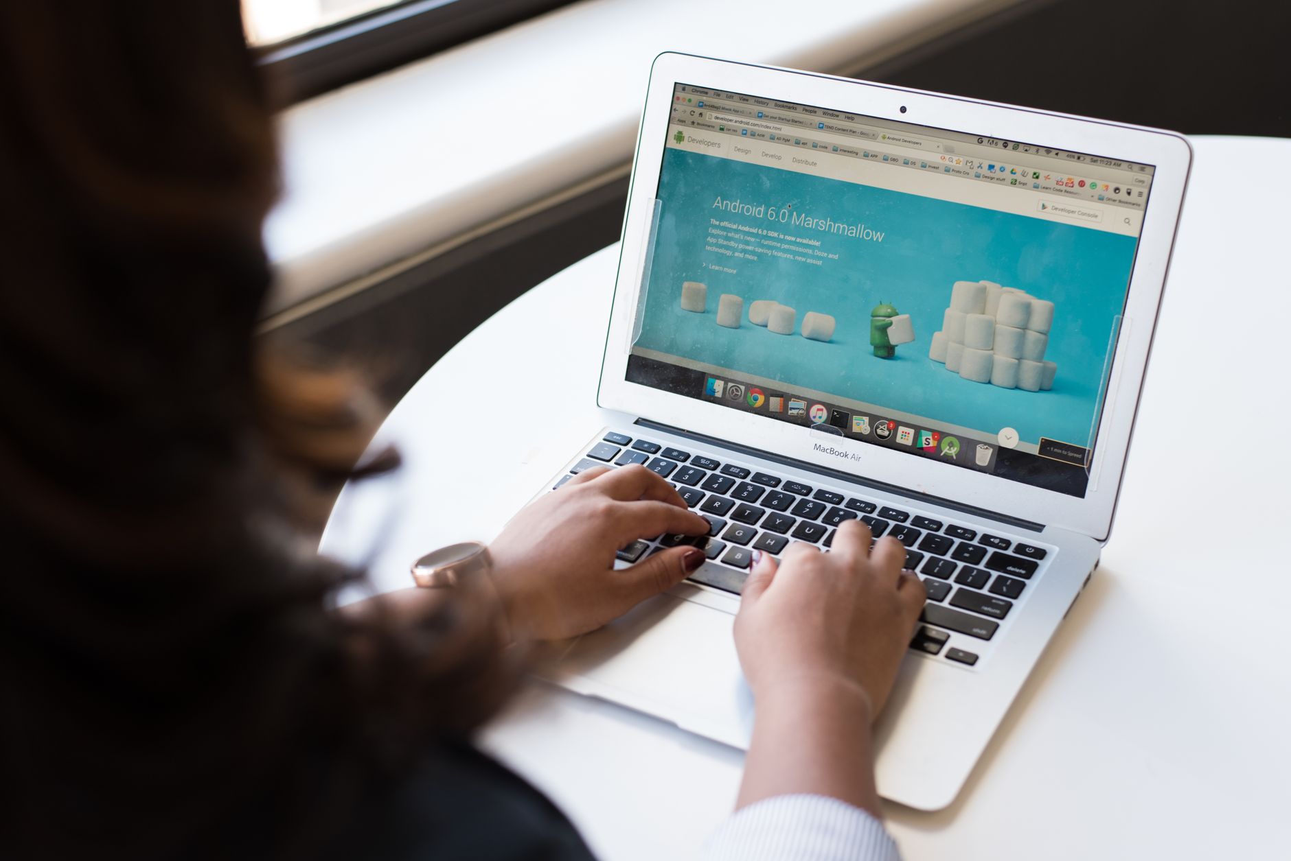 A person testing a website on a laptop