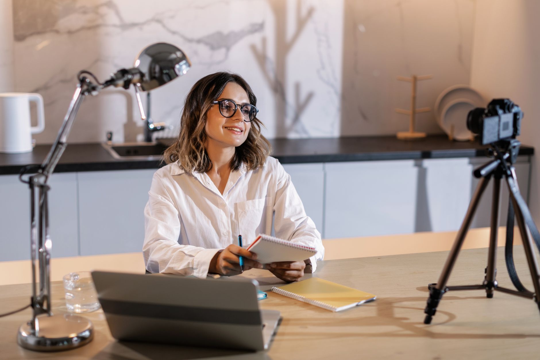 A woman recording a course at her desk
